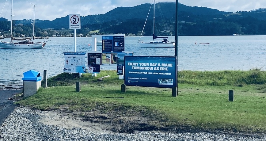 Advertising billboard at a boat ramp