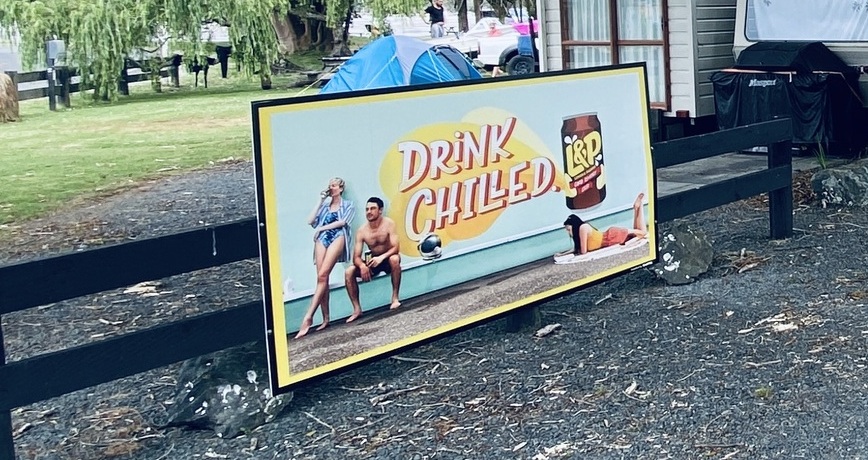 L&P summer advertising sign at campground