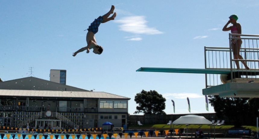 Todd Energy Aquatic Centre person jumping off diving board